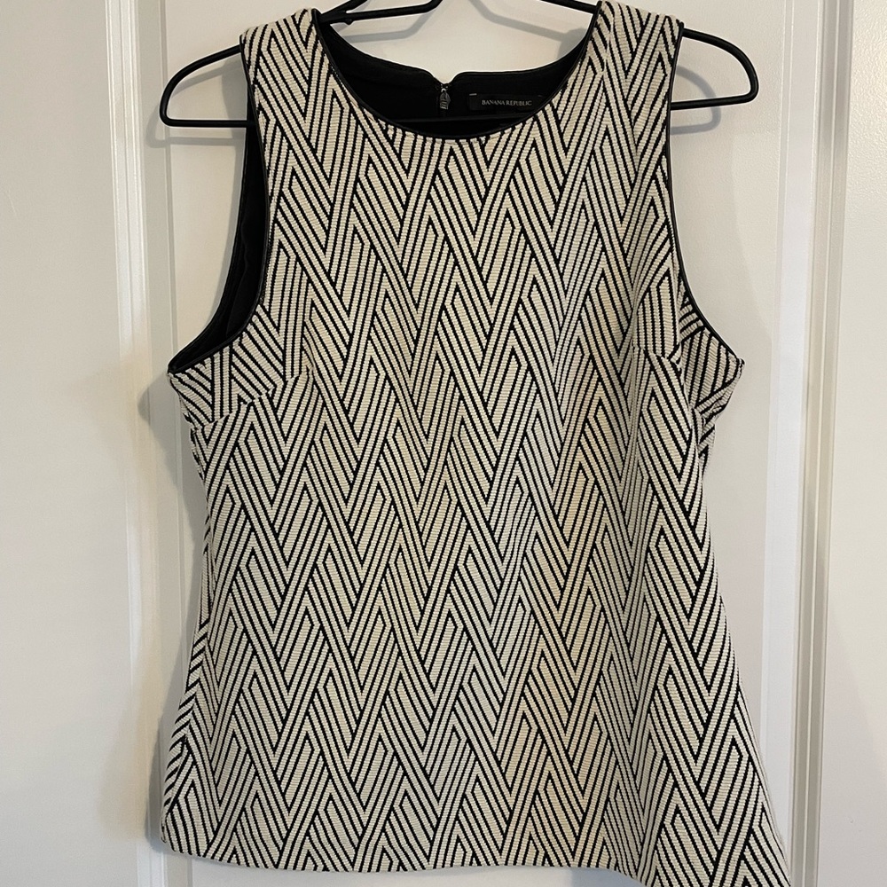 Cream and black colored blouse